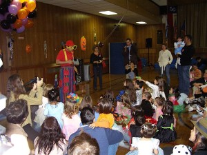 a large crowd at a PAA Halloween party